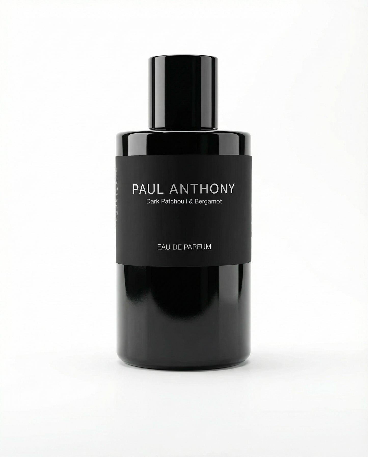 Black perfume bottle labeled 'Paul Anthony' on a white background