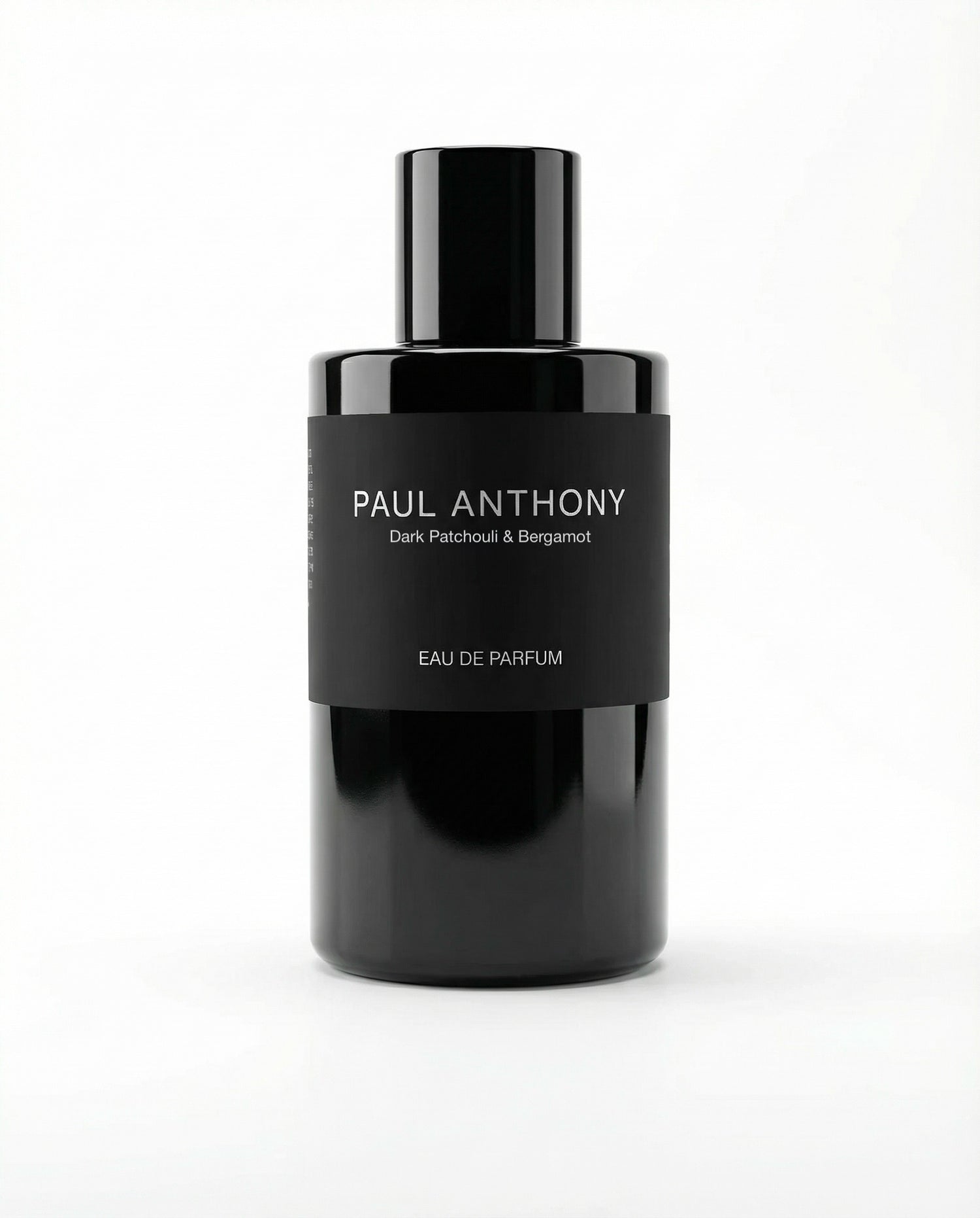 Black perfume bottle labeled 'Paul Anthony' on a white background
