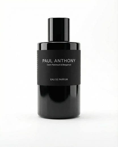 Black perfume bottle labeled 'Paul Anthony' on a white background