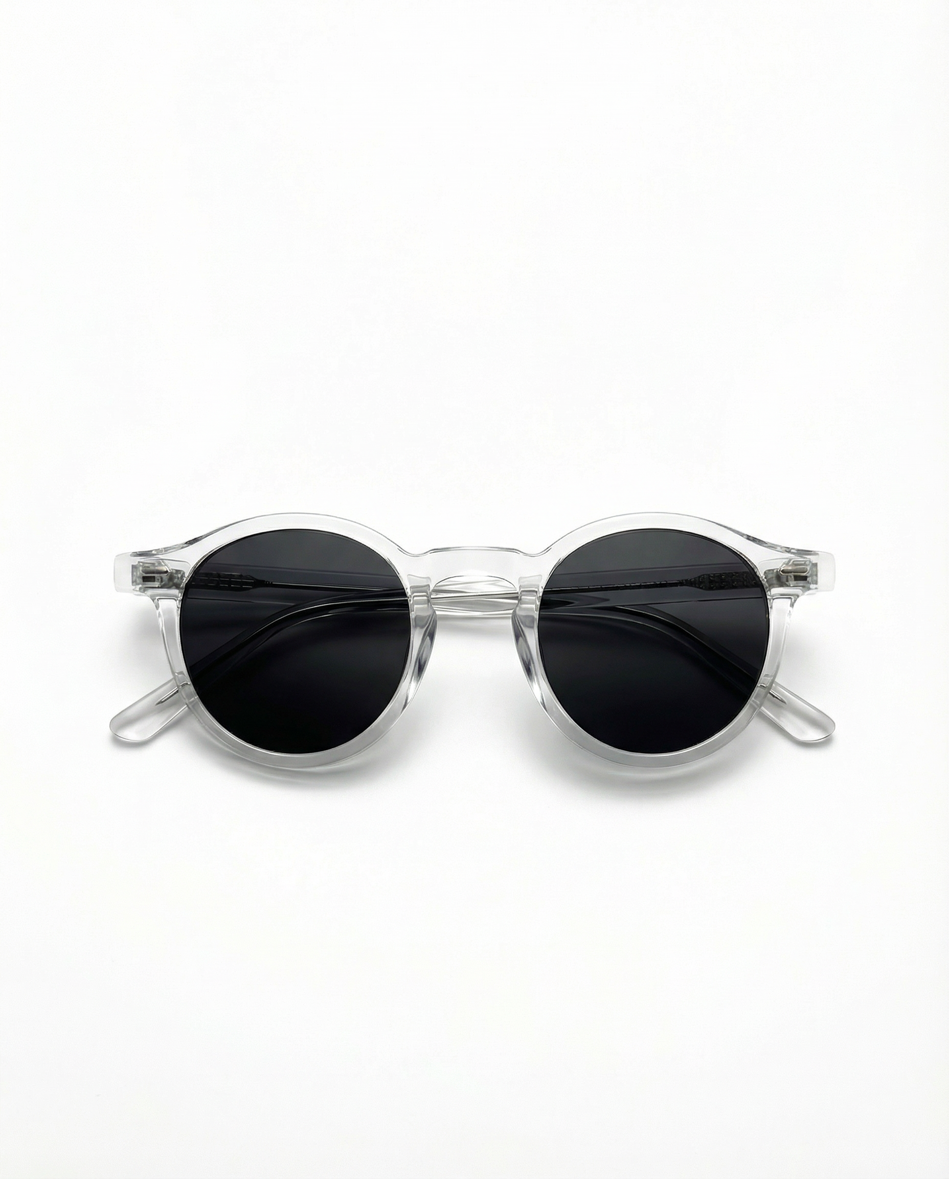Clear frame sunglasses with black lenses on a white background