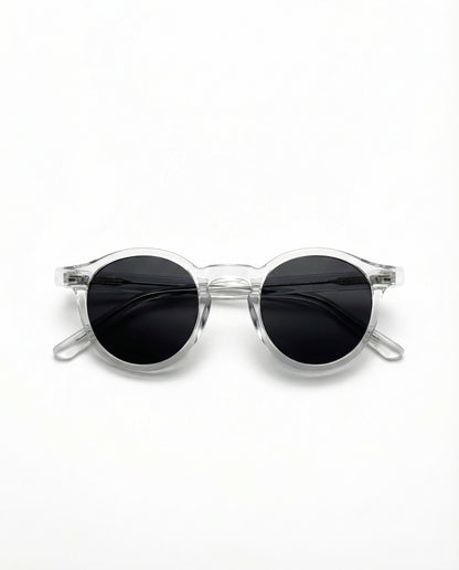 Clear frame sunglasses with black lenses on a white background