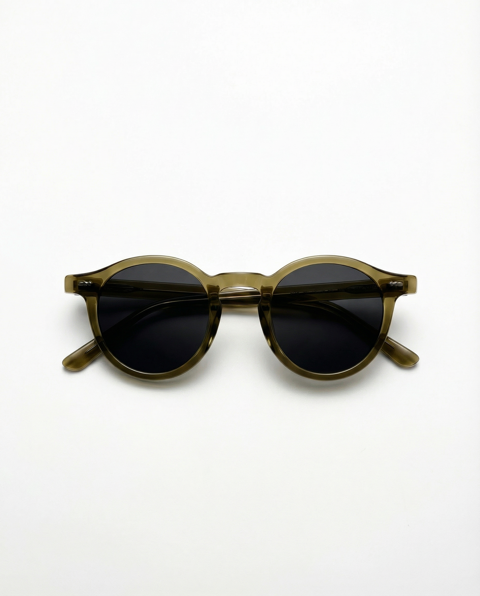 Round sunglasses with dark lenses and brown frame on a white background